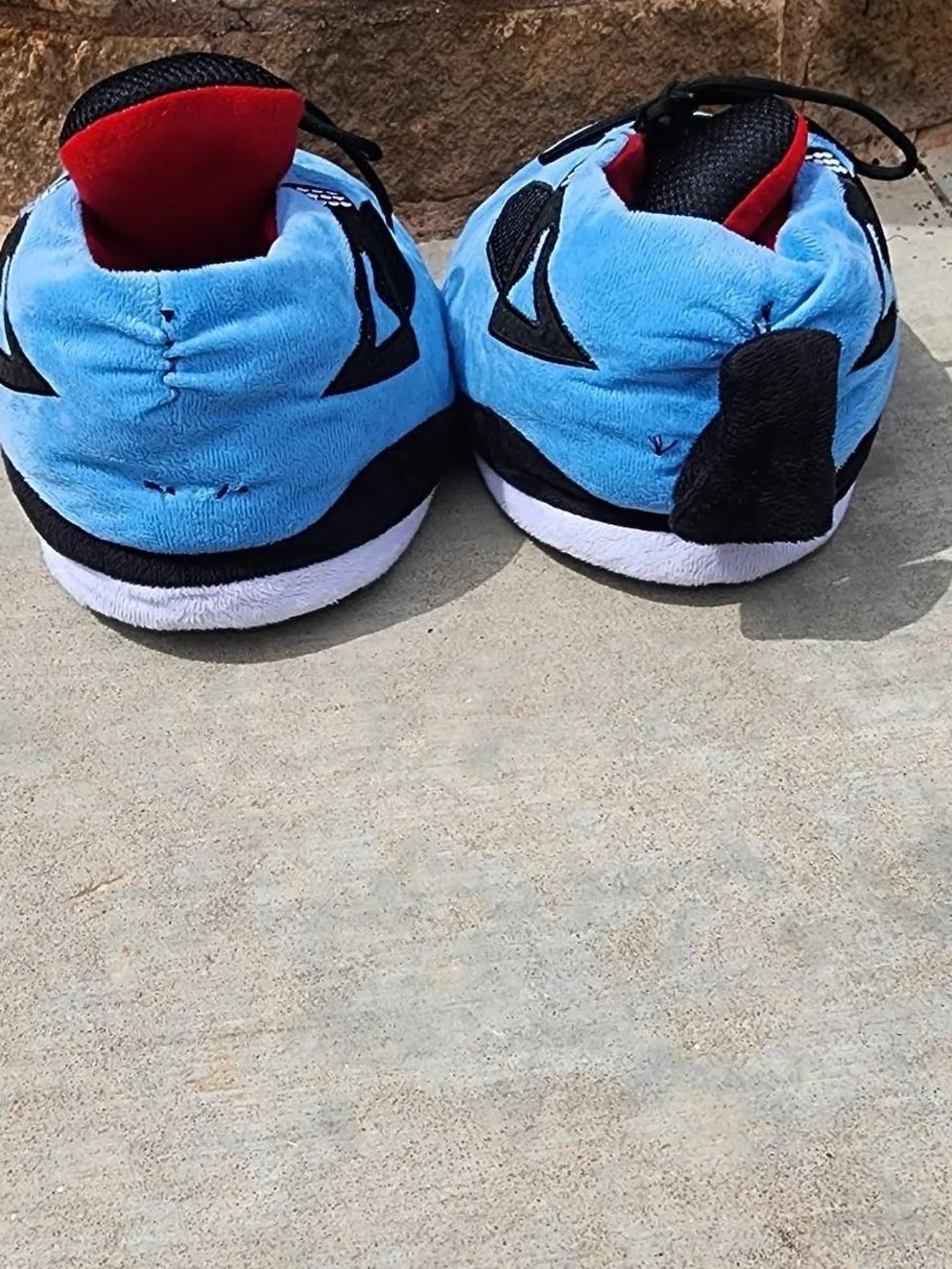 Air Jordan 4s Kids Light Blue Plush Lace-Up Sneakers with Black Accents